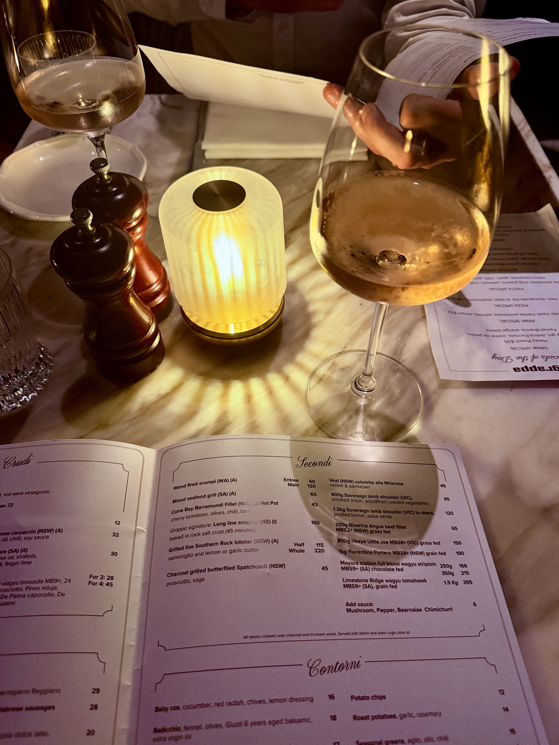 Reading the Grappa menu over wine